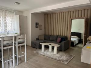 a living room with a couch and a table at Rayand in Mostar
