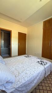 a bedroom with a large bed in a room at Chez Iceyy in Tangier +3 photos