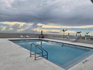 a large swimming pool on top of a building at Funshine Sunset Beach in St. Pete Beach