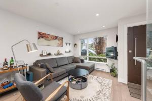 a living room with a couch and a table at Elite Townhouse @ the Shipyards in North Vancouver