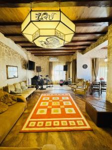 a large living room with a large rug on the floor at Дом Каролино-Бугаз у моря in Zatoka