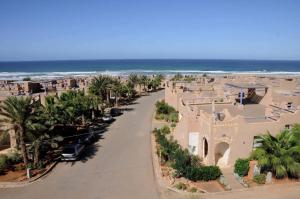 an aerial view of a resort with the ocean at L'Echappée Belle in Sidi Boû el Fedâïl