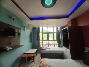 a room with a room with a bed and a window at Hotel Royal Inn in Nawākot