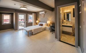 a bedroom with a bed and a desk and a sink at Guney House by Villa Safiya in Fethiye +72 photos