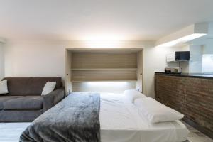 Posteľ alebo postele v izbe v ubytovaní Suites Garden Estudio 1