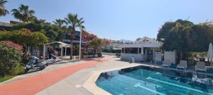 a swimming pool in front of a house at Guney House by Villa Safiya in Fethiye