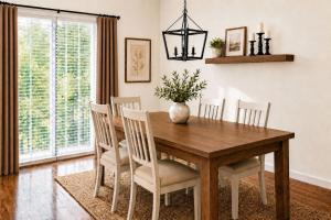 a dining room with a wooden table and chairs at TIMBER TRAIL RETREAT in Steamboat Springs