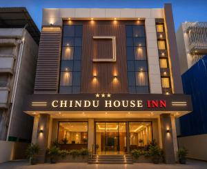 a building with a chino house inn sign on it at CHINDU HOUSE Inn in Chennai