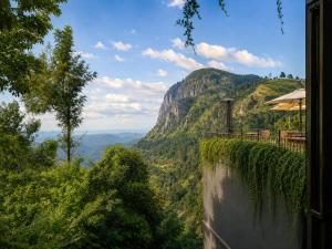 a room with a view of a mountain at HIDE ELLA Hotel & Resort in Ella