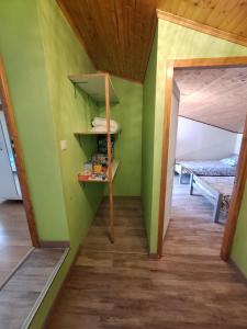 a room with green walls and a wooden ceiling at Gite de la véore in Chabeuil +14 photos