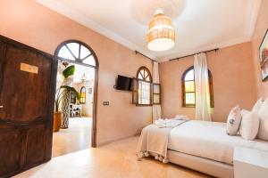 a bedroom with a large bed in a room at Palais Zoya in Marrakesh +48 photos