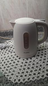a coffee pot sitting on top of a table at Casa Rosàlia in Castro Daire