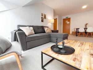a living room with a couch and a coffee table at Apartamentos PORTA NOVA 2 in Lugo