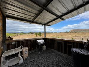 a screened in porch with a view of a field at Finca Sol y Sal  +6 photos