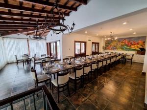 a large room with a long table with chairs at Rincon del Cerro I in San Lorenzo
