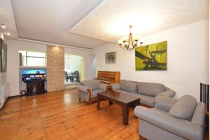 a living room with a couch and a table at Villa in the center of Yerevan in Yerevan