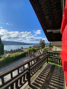 a balcony with a view of the water at Le Mazot in Veyrier-du-Lac