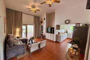 a living room with a couch and a table at Casa M&B in Las Galeras