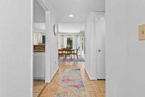 a hallway with a kitchen and a dining room at 735 Spinnaker Beach House in Seabrook Island