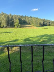 a view of a field from a fence at Guest house in Wojtkowa