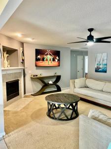 a living room with a couch and a table at Grand Springwater Estate in Savannah