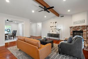 a living room with two couches and a fireplace at Megginson Apartments in Dasmariñas
