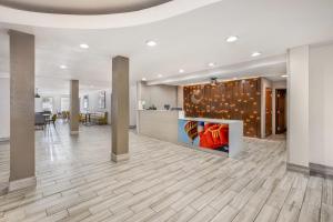 an office lobby with a reception desk and a table at Comfort Suites Albuquerque-North Journal Center in Albuquerque +33 photos