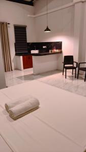 a living room with a white rug on the floor at Coco Villa in Talpe