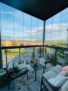 a living room with a view of a large window at Arctic Privé Panorama Residence Alta in Alta