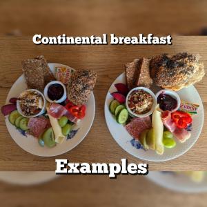 two plates of food with different types of food at Katelenas Bed & Breakfast in Glesborg
