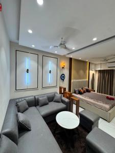 a living room with a couch and a table at Myro stays in Ghaziabad
