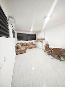 a living room with a couch and a table at Azur Apartments Bar in Bar