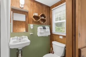 a bathroom with a sink and a toilet at Phoenicia Lodge in Phoenicia +68 photos