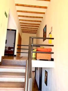 a staircase in a room with a stair case at Fincas Panaca Herreria 23 in Quimbaya +2 photos