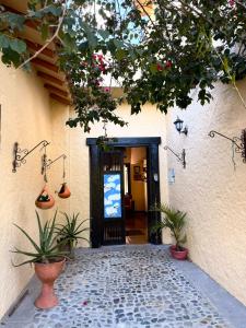 a door to a building with plants in front of it at Fincas Panaca Herreria 23 in Quimbaya