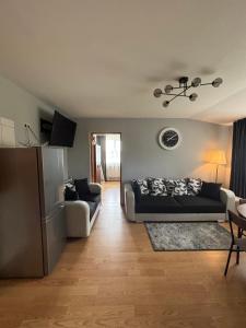 a living room with a couch and a table at Pas Kastyti in Palanga
