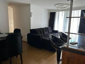 a living room with a couch and a table and chairs at Luxurious Stay con 3 habitaciones in Bello +51 photos