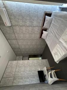 a bedroom with a large bed at Shodlik Hotel 