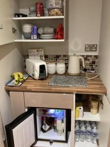 a kitchen with a counter with a mixer on it at The Anfield Apartment in Liverpool
