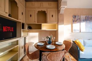 a small dining room with a table and chairs at Atlas Golf Resort in Marrakesh