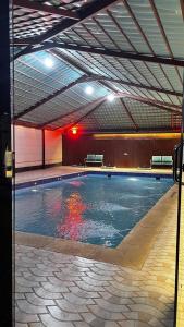 a large swimming pool in a large building at شاليهات Luma الفندقية in Bisha Airport