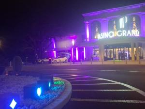 a building with purple lights in front of a street at Espace naturel in La Tour-de-Salvagny +11 photos