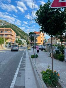 a street with a sign on the side of the road at Te gjoli in Pogradec