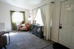 a living room with a couch and a chair at Pet-Family-Friendly Duplex with Parking in Wasilla