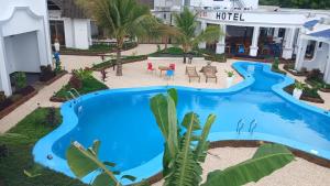 an overhead view of a pool at a hotel at Googles Beach Hotel Zanzibar in Zanzibar City