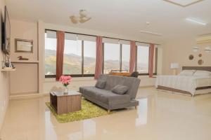 a large living room with a bed and a couch at Apartamentos - Torre de Cali in Cali +93 photos