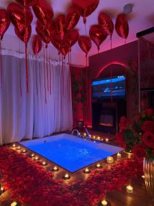 a room with a hot tub with red balloons at Ama Esclusive Spa Firenze in Florence +29 photos