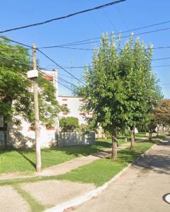 a street with trees on the side of a road at Departamento Martirena in Colón Buenos Aires Province
