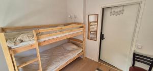a couple of bunk beds in a room at Frostavallen Hostel in Långstorp