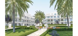 an exterior view of a building with palm trees at Luxury La Cala de Mijas Sunset in Mijas Costa